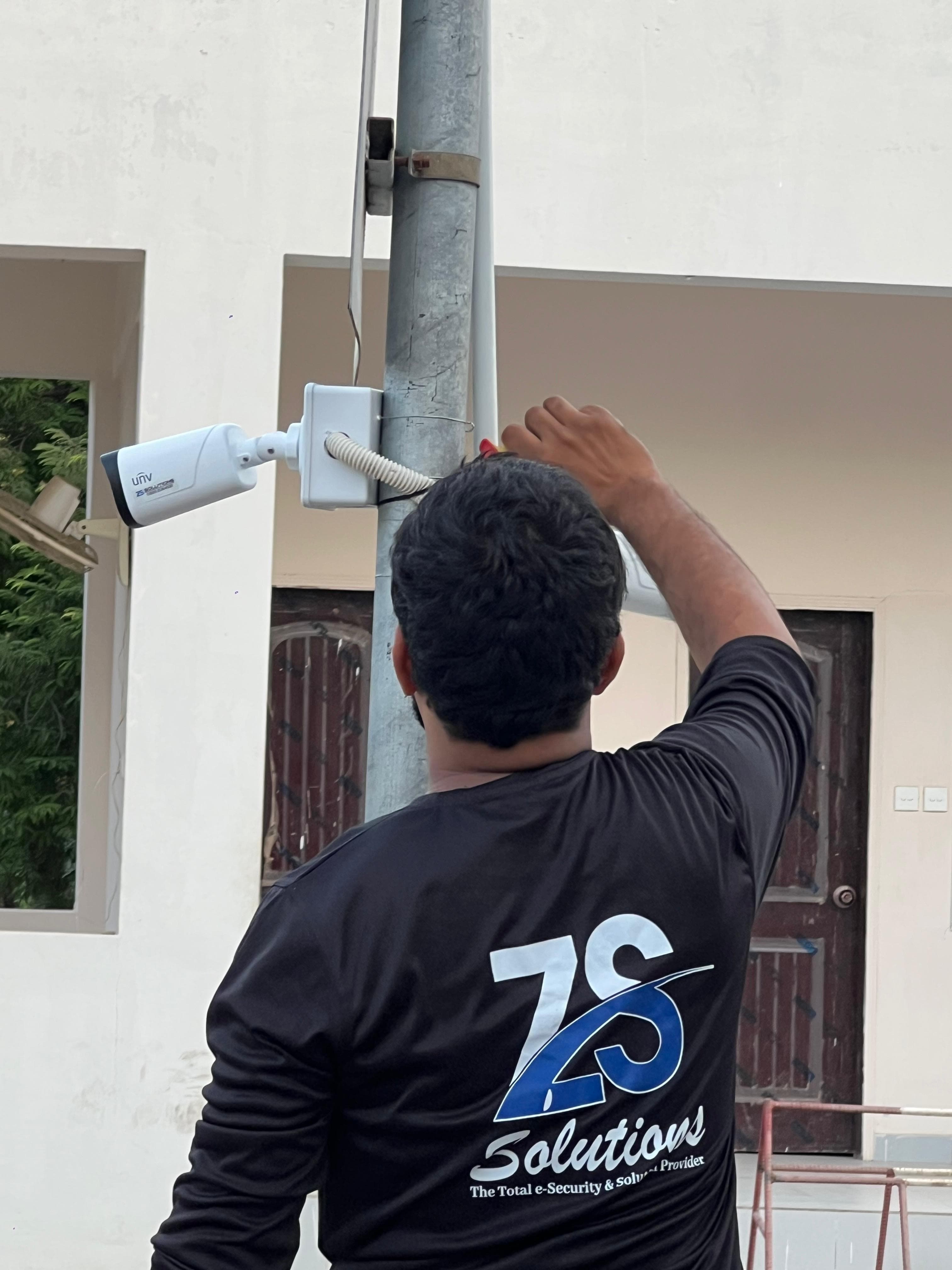 ZS Solutions engineers completing an outdoor security deployment